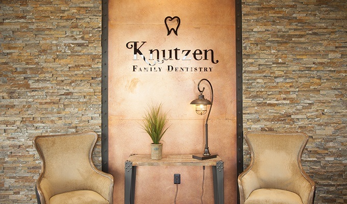 Seating area in fornt of Knutzen Family Dentistry sign