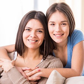 Smiling mother and daughter