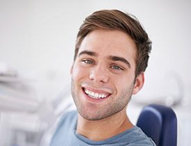 Happy man smiling in dental chair